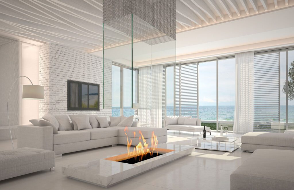 Modern living room with ocean views and a sleek fireplace.
